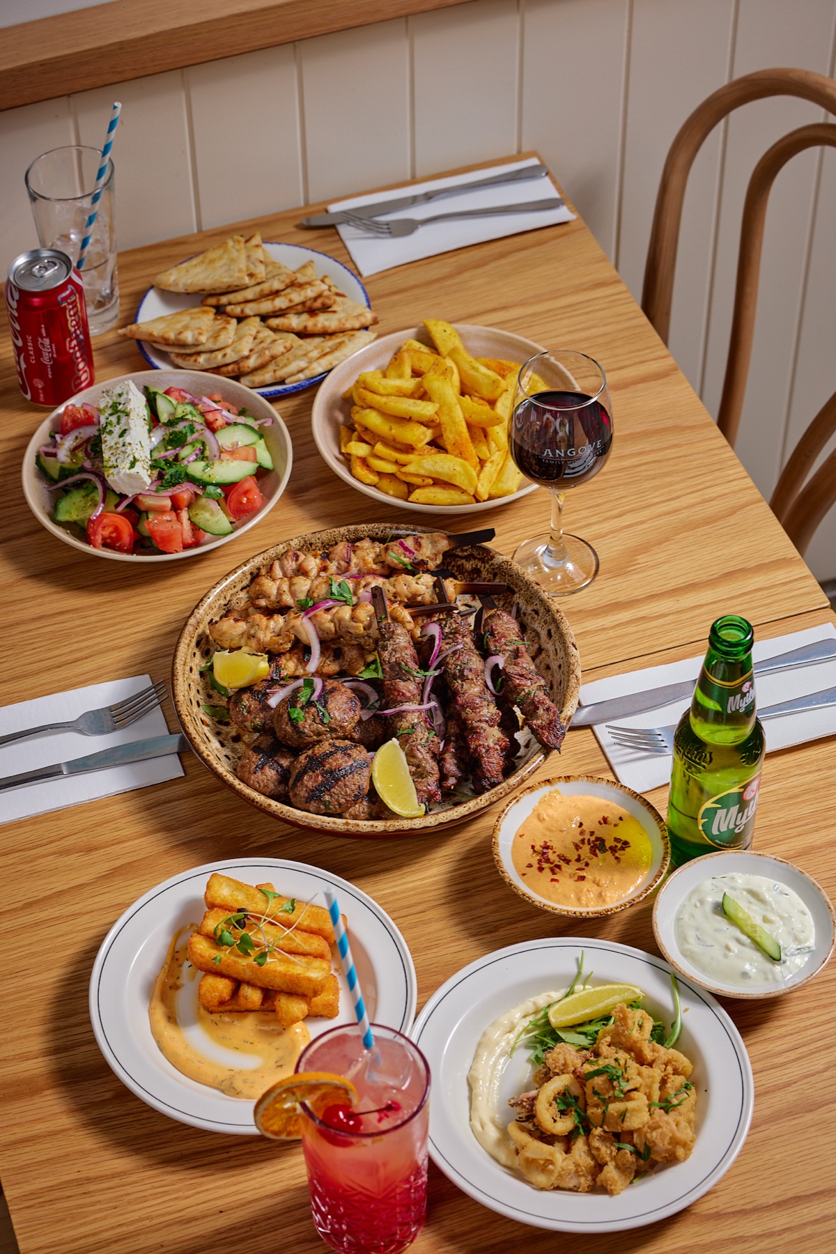 Yassas Family Feast spread with Angove wine, Mythos beer, meat platter, Greek salad and dips - Father's Day at Yassas