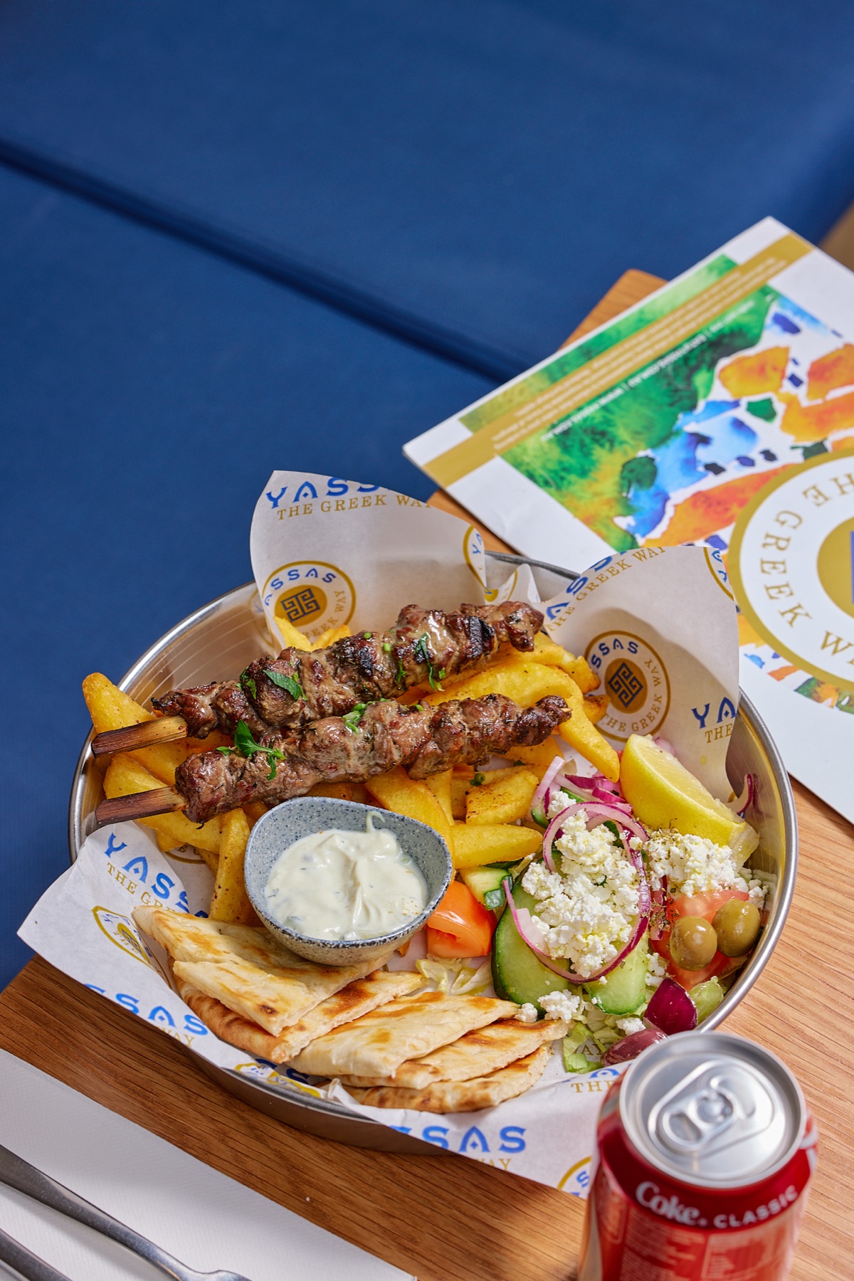 Yassas signature souvlaki plate with chips, Greek salad, tzatziki and pita